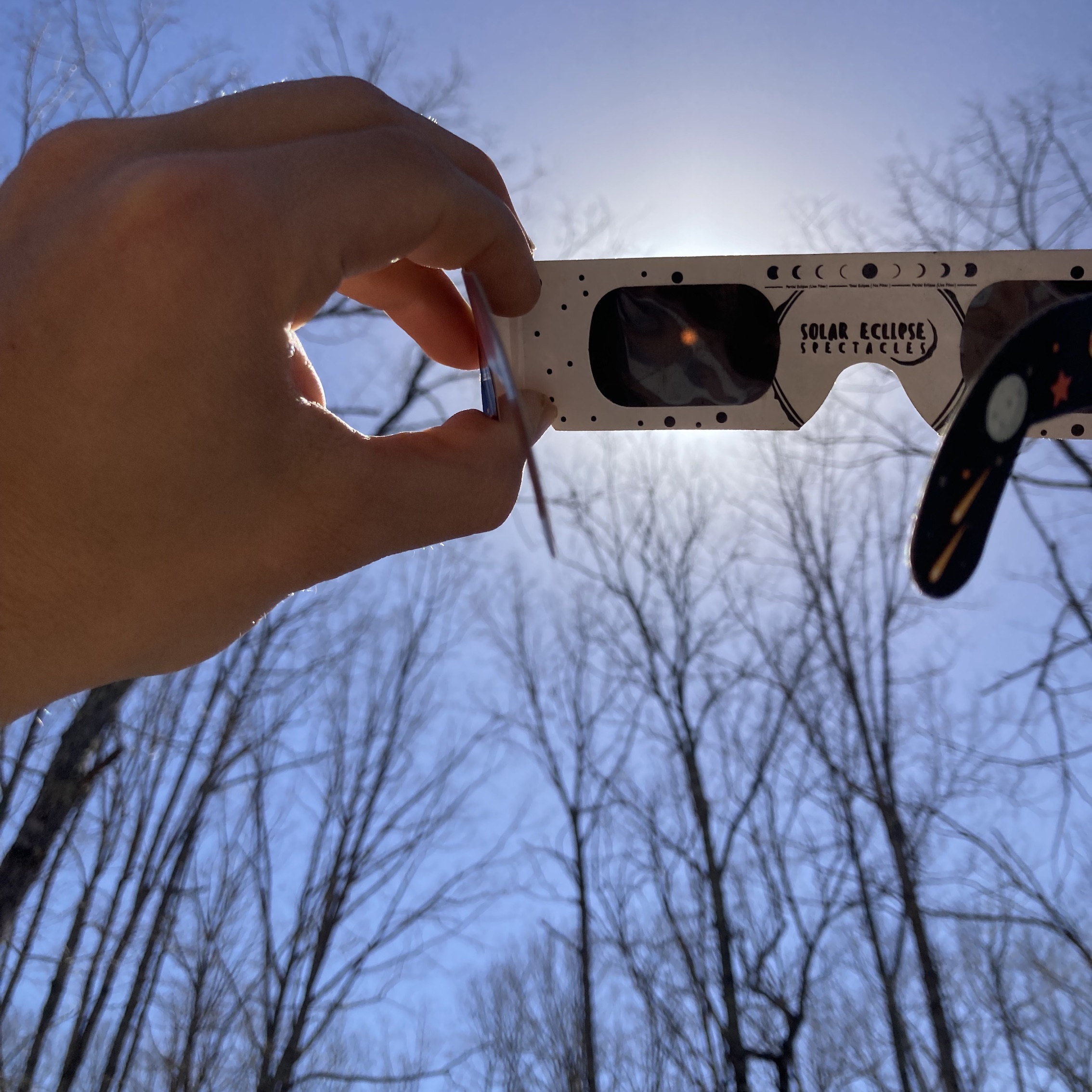 Holding Eclipse Glasses, April 2022